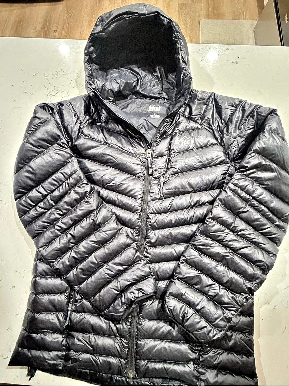 REI Co-op women’s size Small black hooded puffer jacket featuring Pertex Quantum